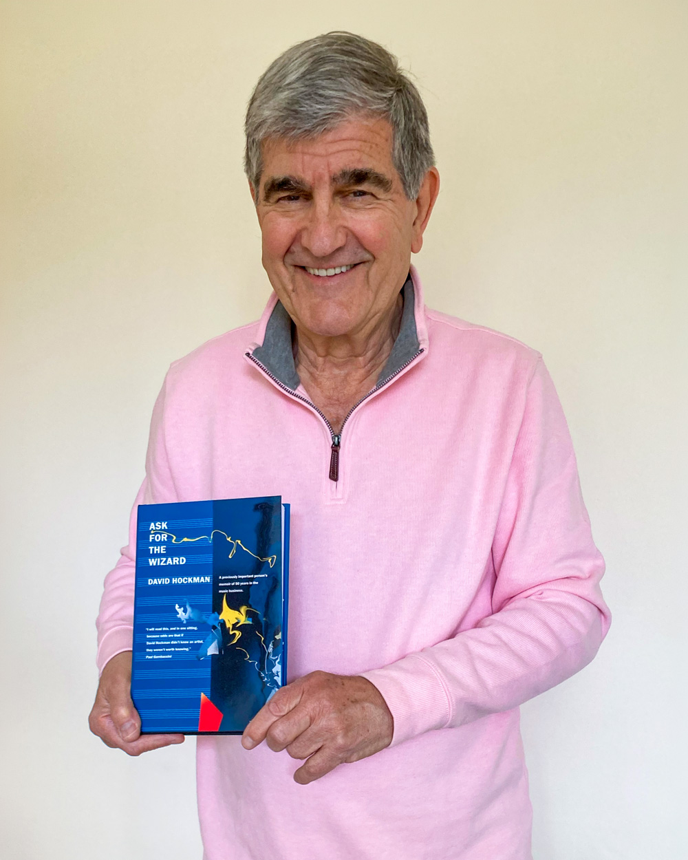 Image of David Hockman holding his bbook Ask the Wizard